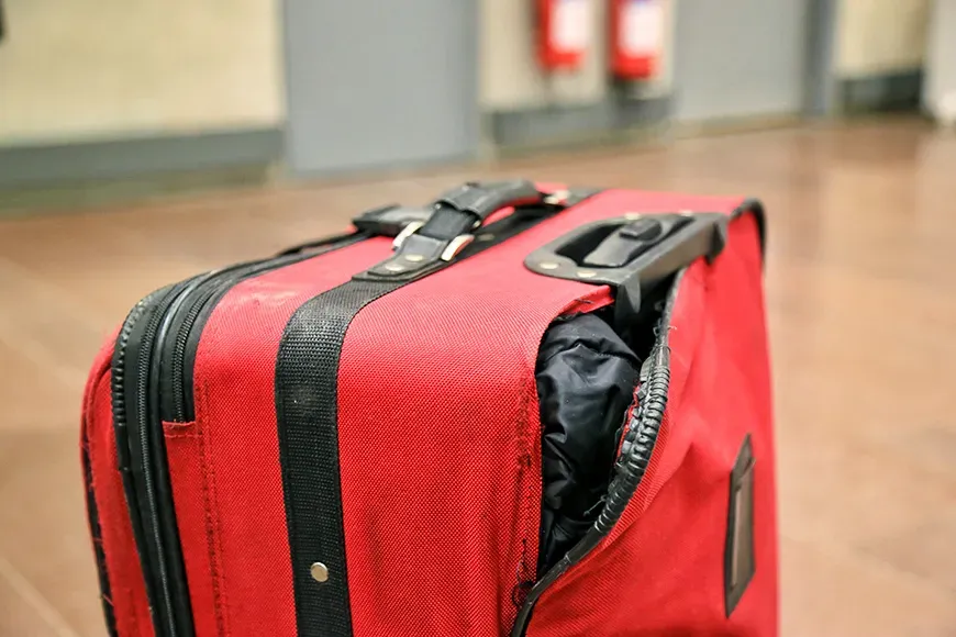 Broken traveling luggage at the airport